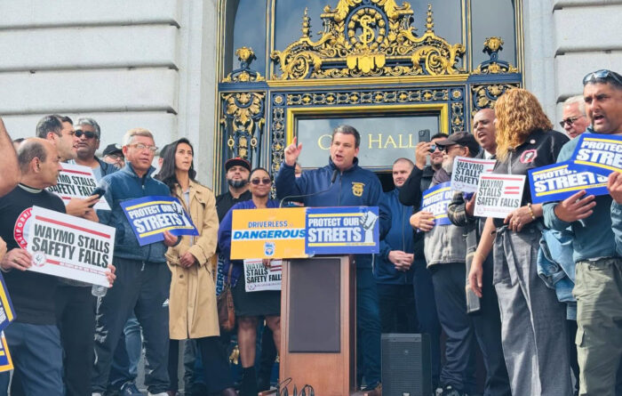 Joint Council 7 President Peter Finn speaks at a rally calling for AV accountability.
